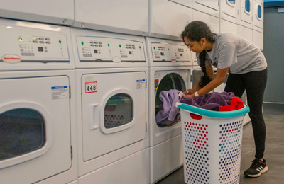 student doing laundry